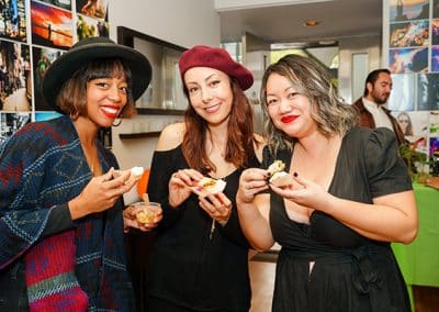 three woman eating at event