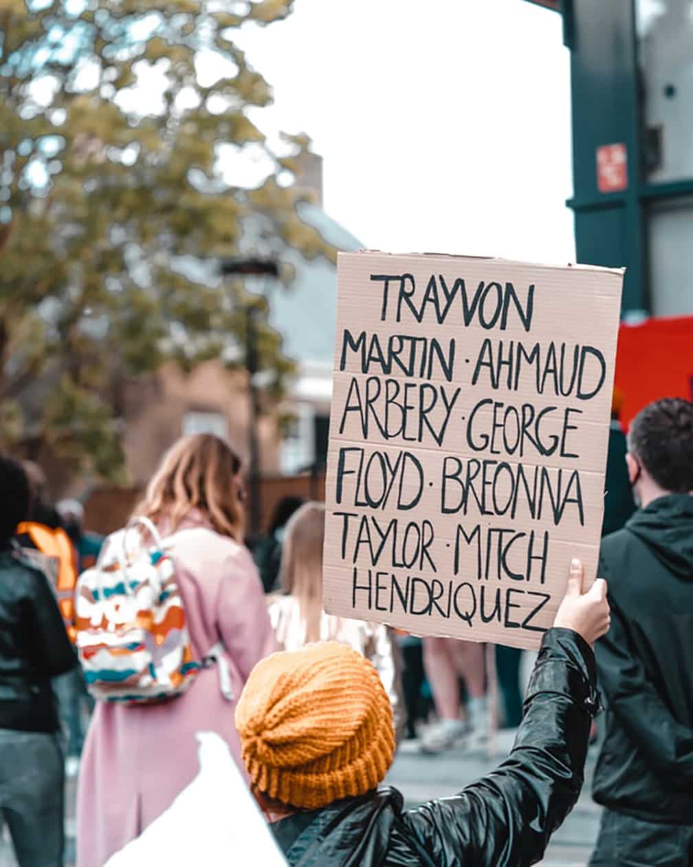 Anti-racism protester with sign